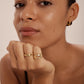 Gold wave stacking ring on finger