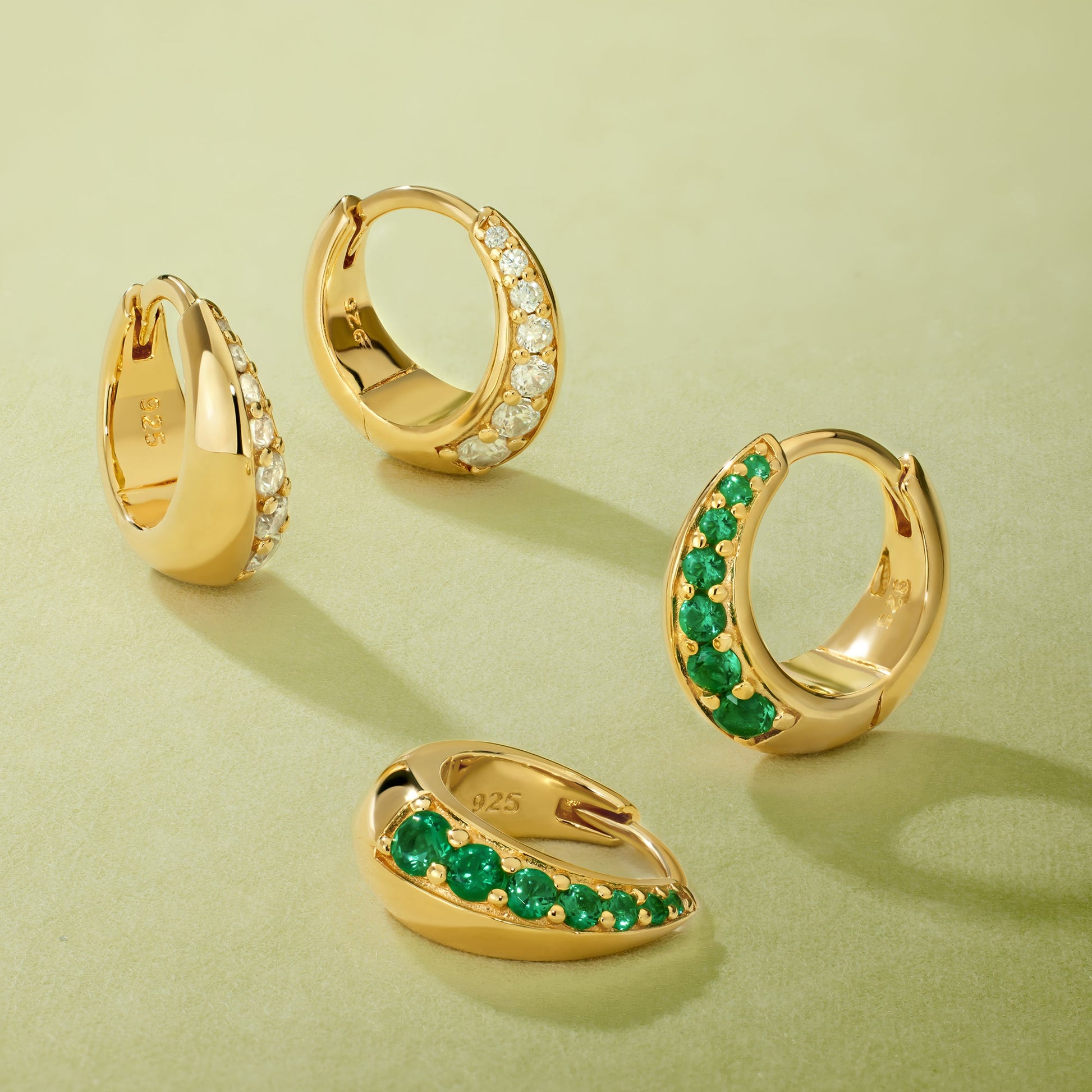 solid silver gold huggies with diamond and green zircon